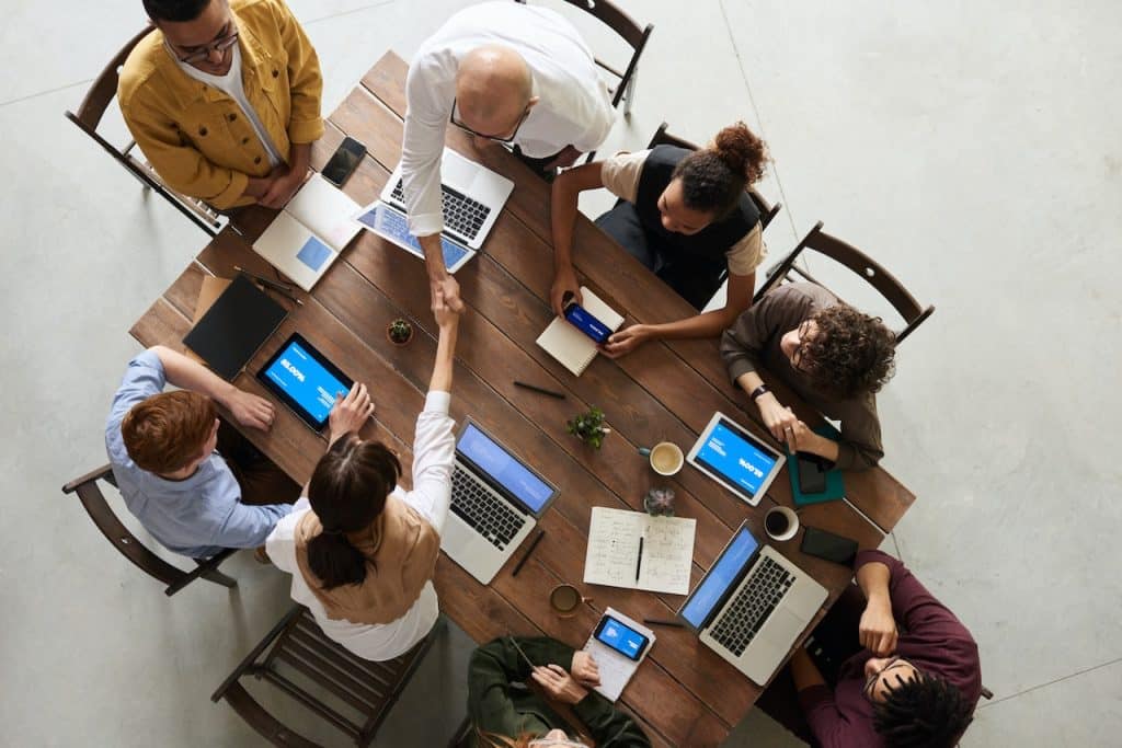 A group of people sitting around a table. 